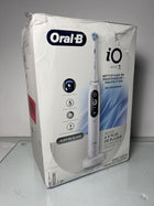 Oral-B iO Deep Clean + Protect Rechargeable Electric Toothbrush, White with Visible Pressure Sensor, 5 Cleaning Settings, 2 Min Timer, an iO Series 7 Toothbrush, 2 Replacement Brush Heads, and Charging Travel Case